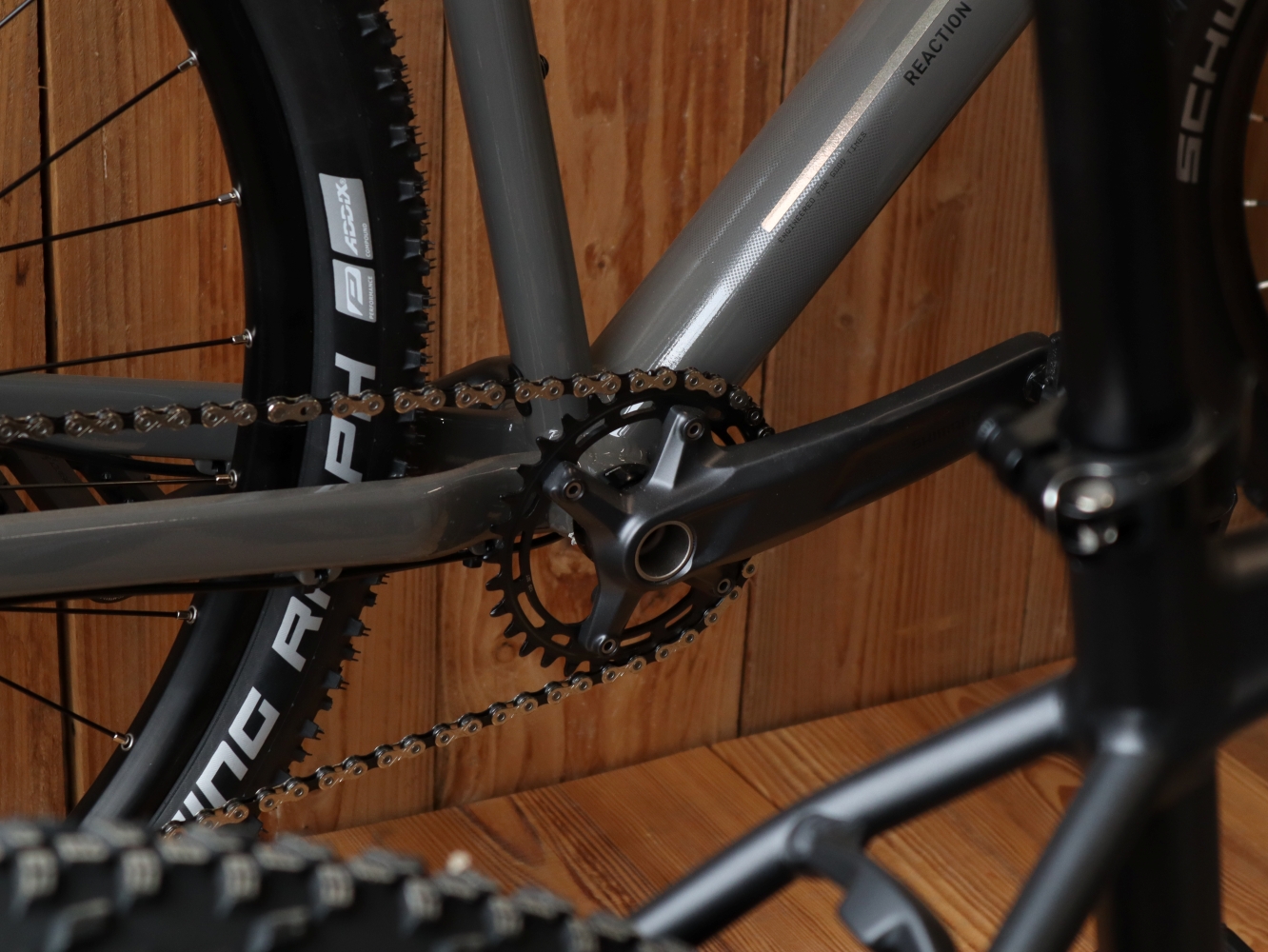 Close-up of the drivetrain on a CUBE Reaction hardtail mountain bike — chainring, chain and frame detail